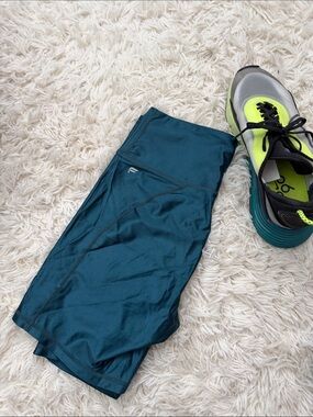 Like new,  Fabletics shorts in bluish green